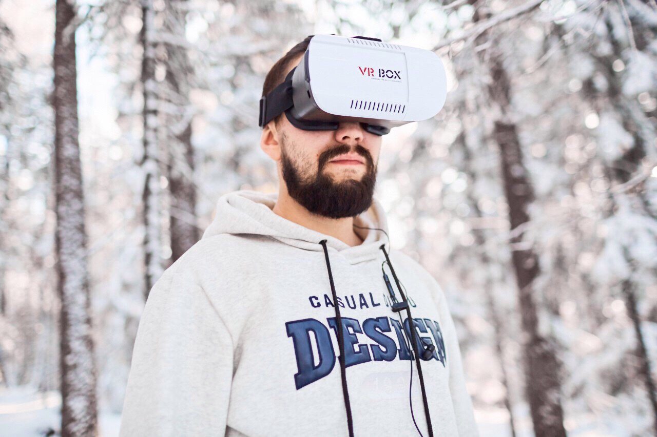 a guy with vr goggles white background